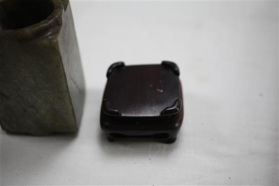 A Chinese grey and black veined jade cong, Ming dynasty, 9.7cm, fitted wood stand